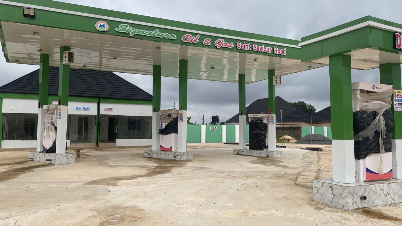 Signature Oil and Gas filling station canopy with multiple pump islands